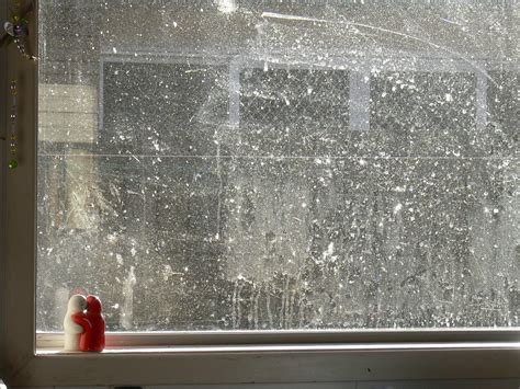 Cleansing negativity: The transformative nature of cleaning a dirty window in dreams