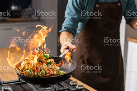 The Symbolic Meaning of a Frying Pan Engulfed in Flames