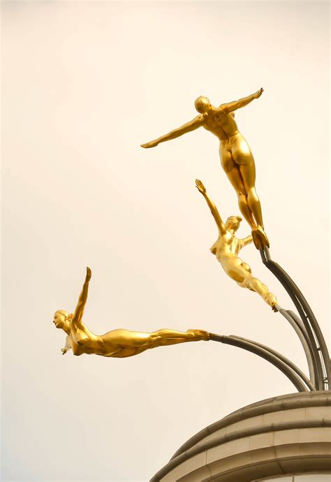The Symbolism Unveiled: Clasping the Golden Swimmers